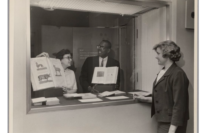 Marilyn Peterson, Karl Bynoe and Georgia Andrews with rare books, 1970s